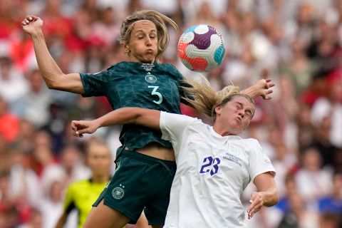 England's Alessia Russo, right, vies for the ball with Germany's Kathrin-Julia Hendrich.