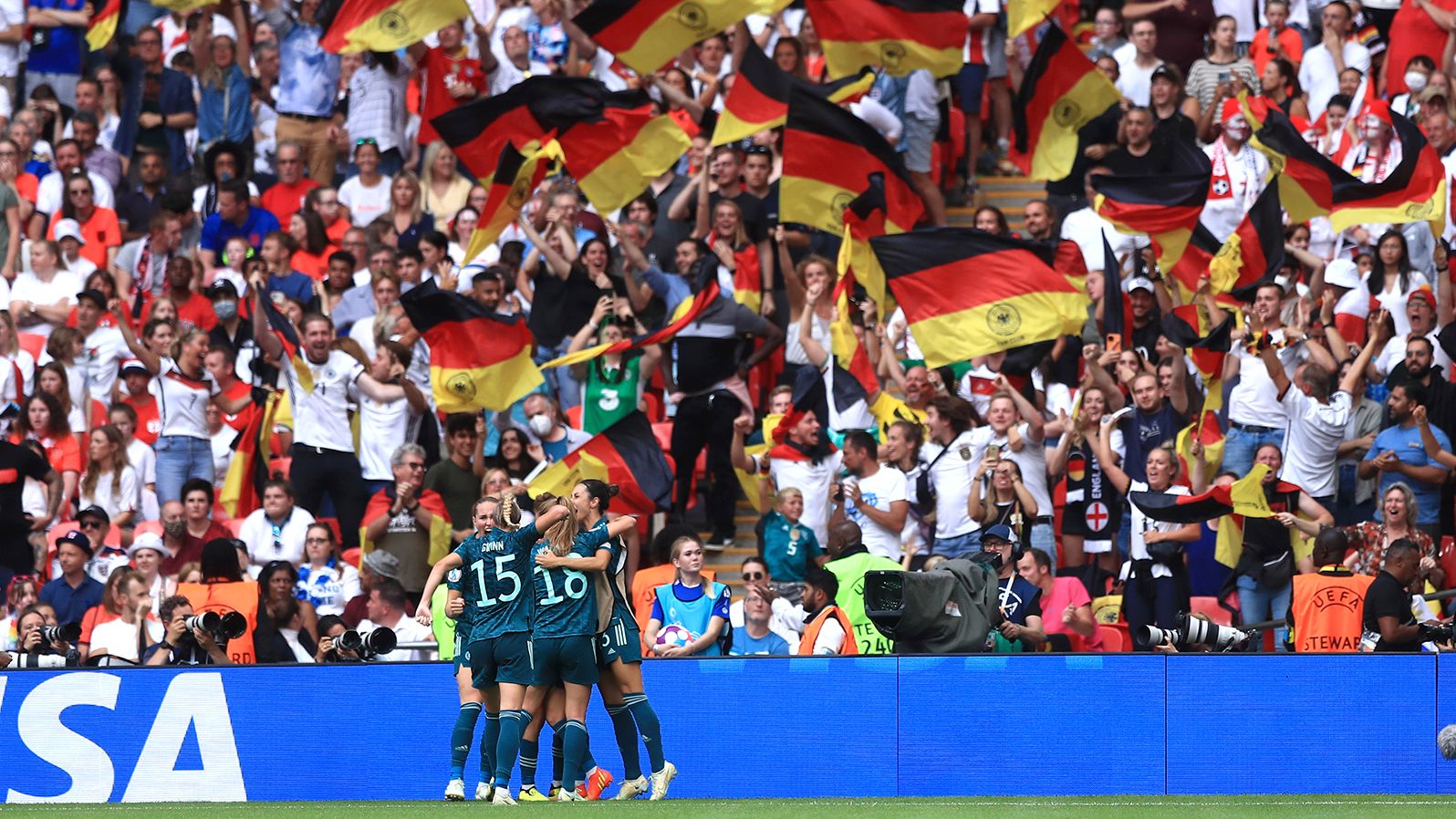 Germany's players celebrate their equalizing goal, scored by Lina Magull.