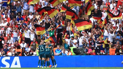 Germany players celebrate Magull's equalizer.