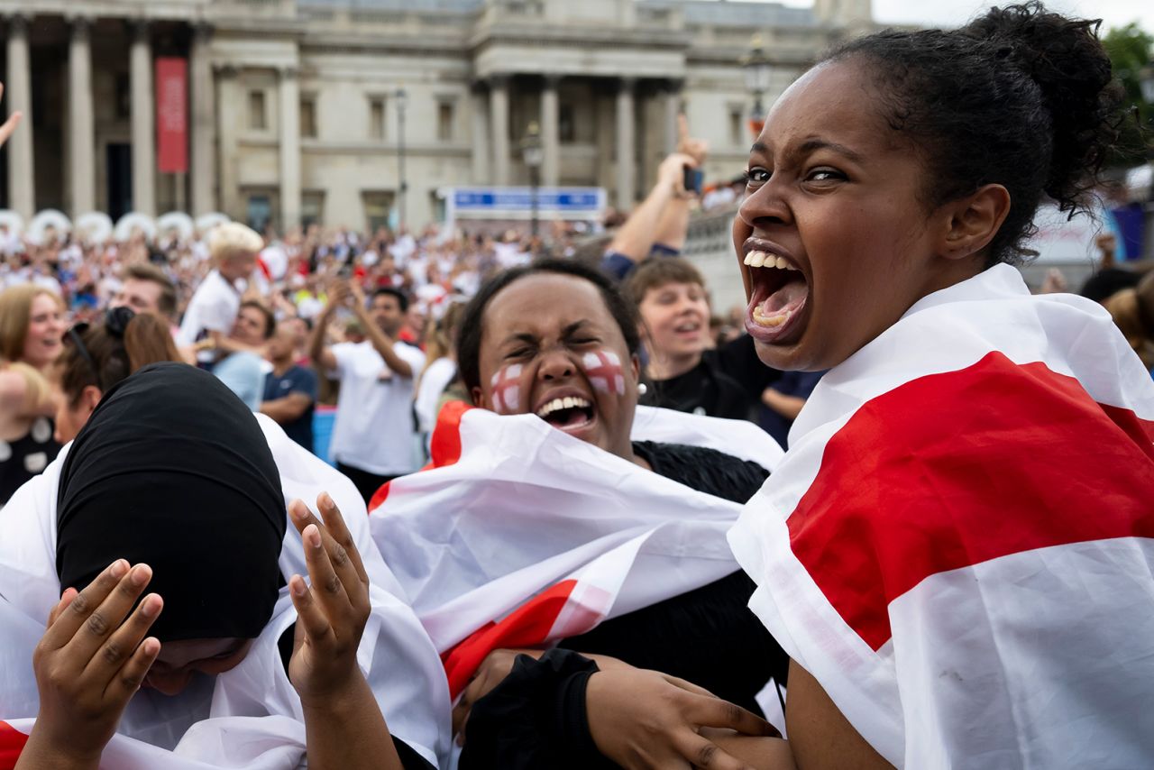 England fans react at Trafalgar Square in London after England scores a goal.