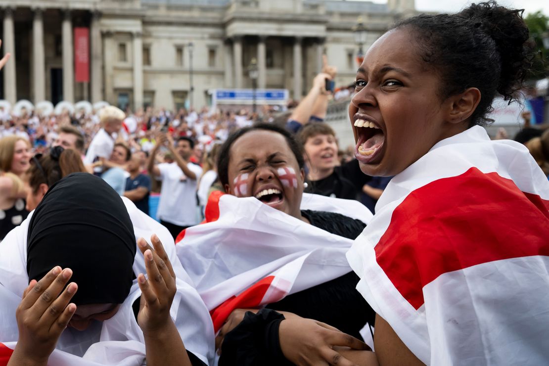 England fans watching the game and celebrating in Trafalgar Square in London.