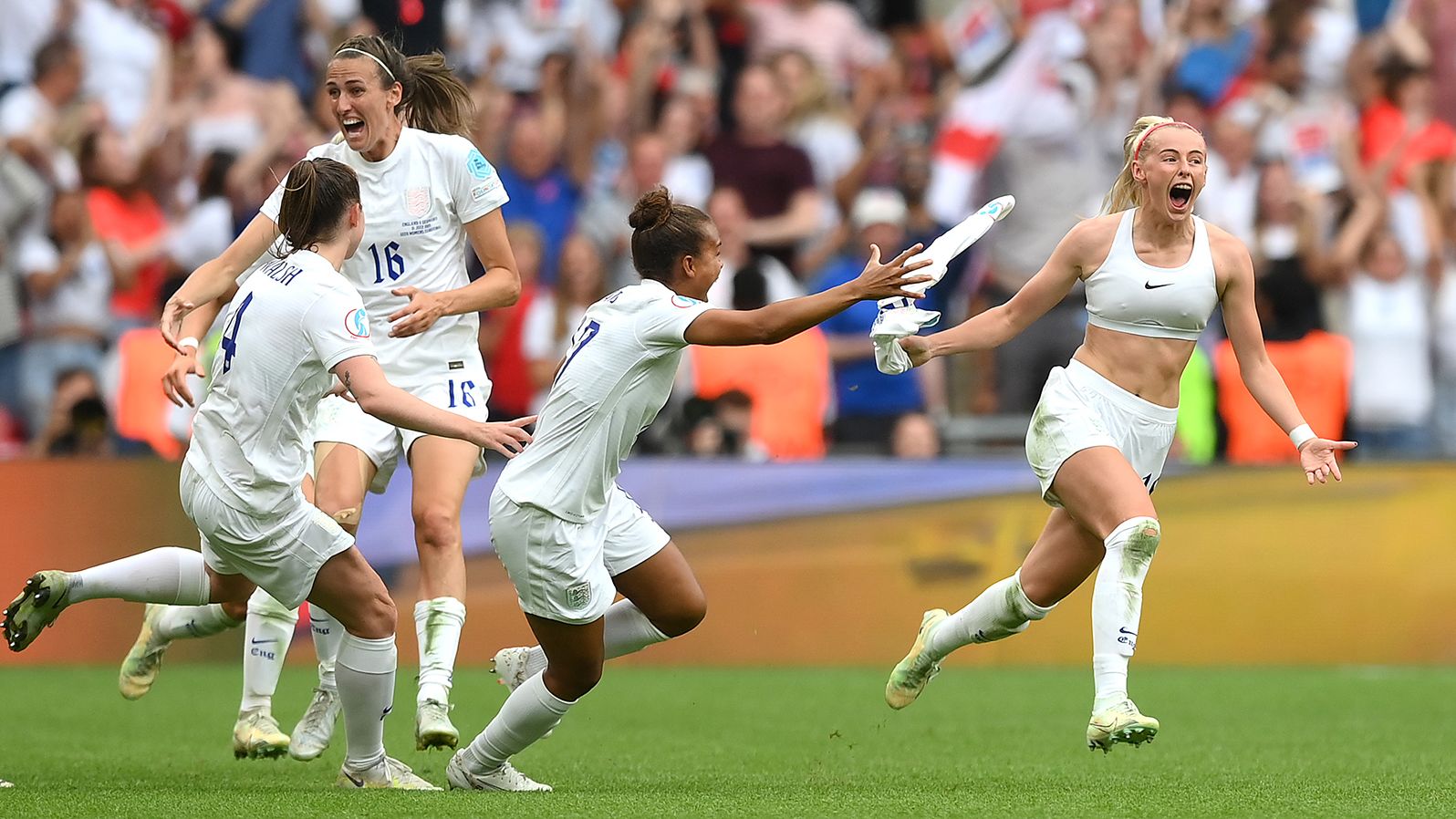 Chloe Kelly of England celebrates with teammates after scoring their side's second goal in extra time.