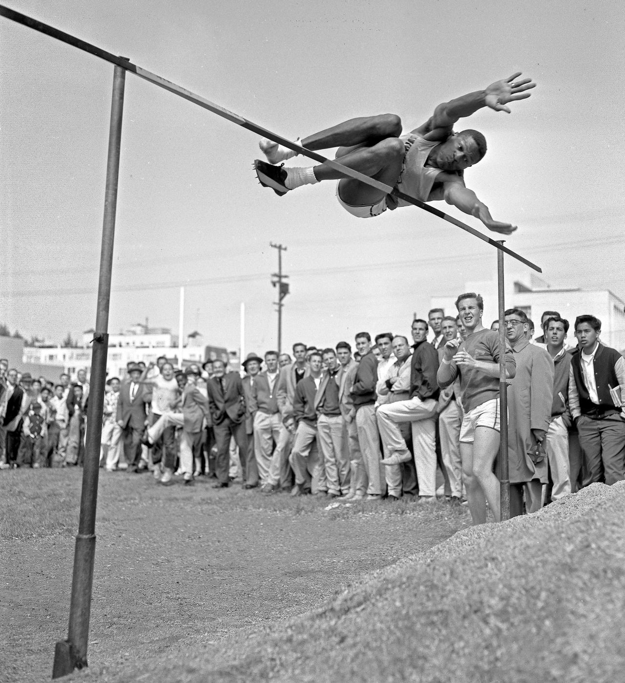Russell competes in the high jump for University of San Francisco during a track meet in April 1956. In the same month, Russell would be selected second overall in the NBA draft by the St. Louis Hawks, before being traded to the Boston Celtics.