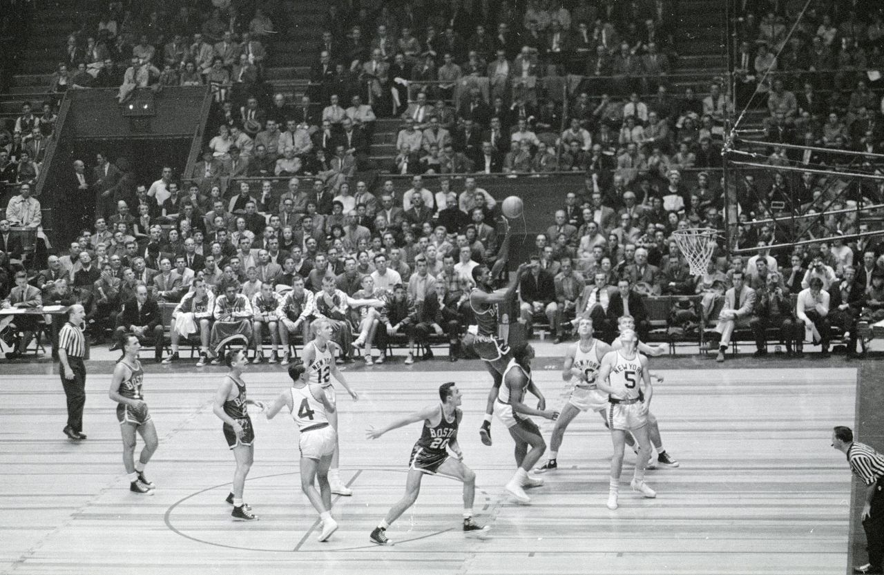 Russell takes a shot during a game against New York in 1957. Russell played his entire career as a center for Boston.