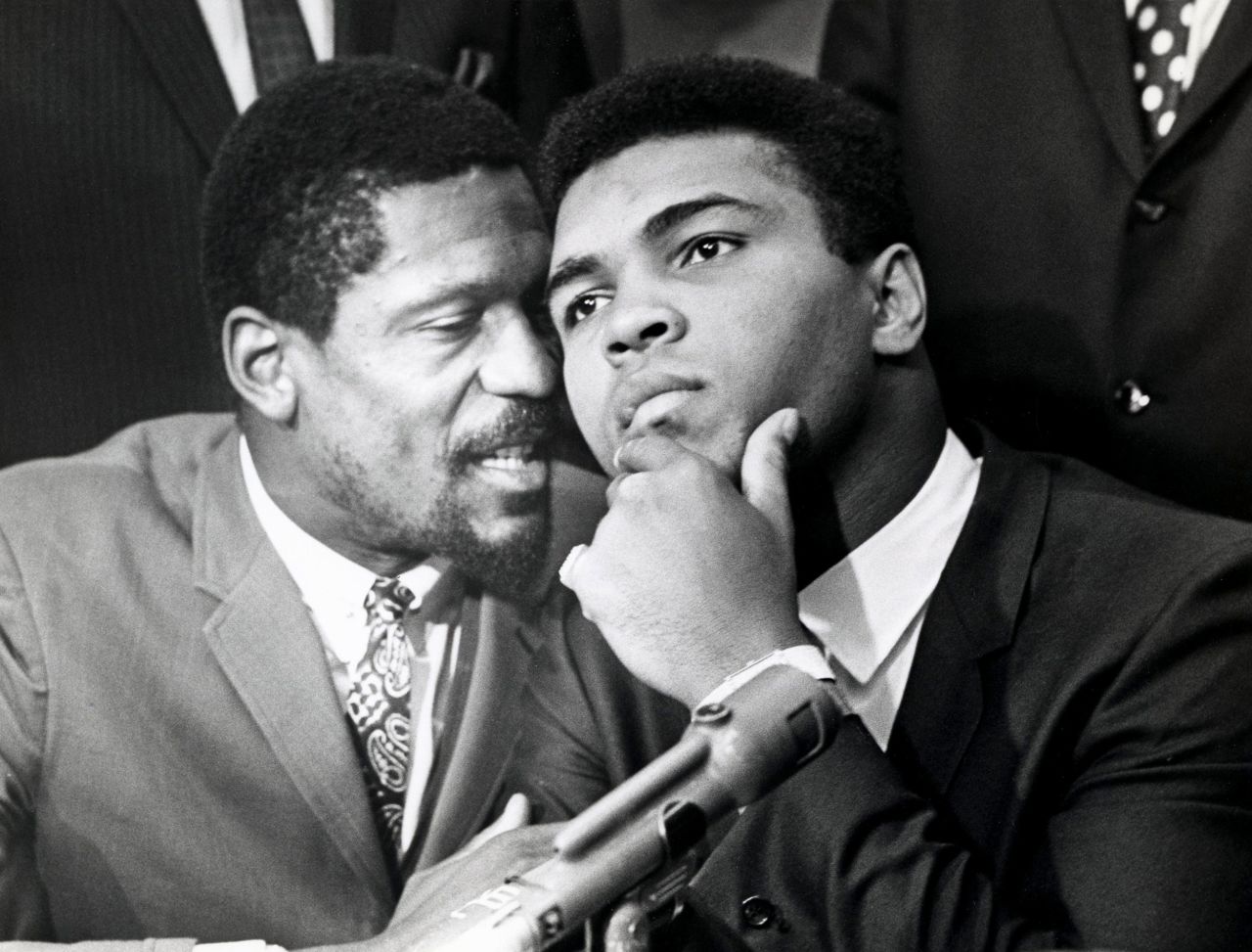 Russell, left, speaks with boxer and fellow civil rights trailblazer Muhammad Ali, in Cleveland, Ohio, in 1967. The two were joined by other Black athletes at a news conference in support of Ali's refusal to fight in the Vietnam War.
