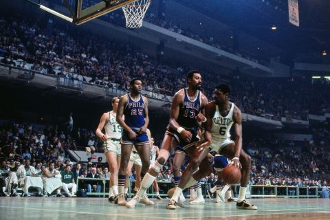 Russell, right, plays against Philadelphia 76ers rival Wilt Chamberlain during a game in Boston in 1968.<br />