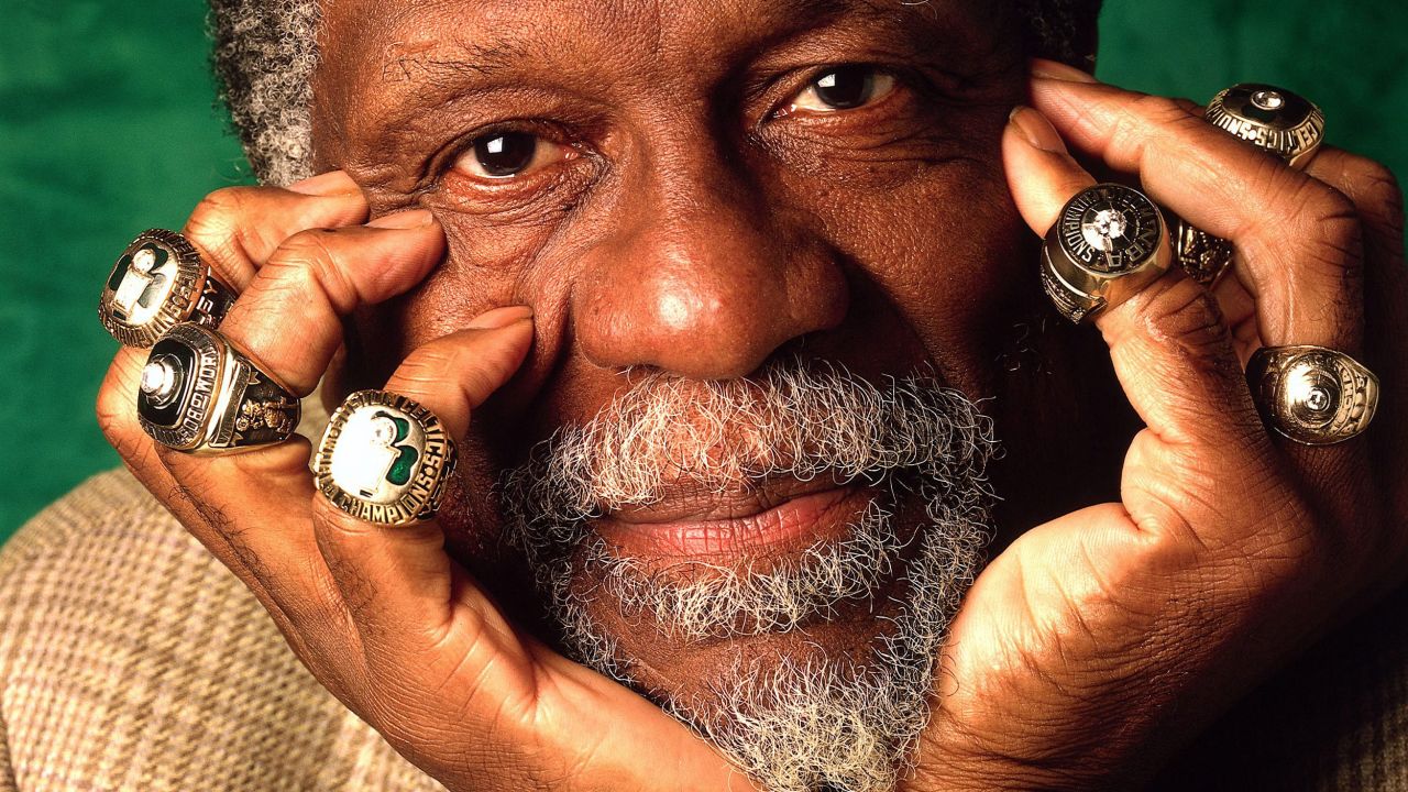 Bill Russell poses with his Championship rings in Boston, Massachusetts, in 1996.