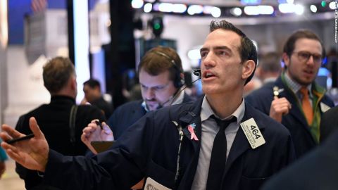 Traders work during the opening bell at the New York Stock Exchange (NYSE) on March 16, 2020.