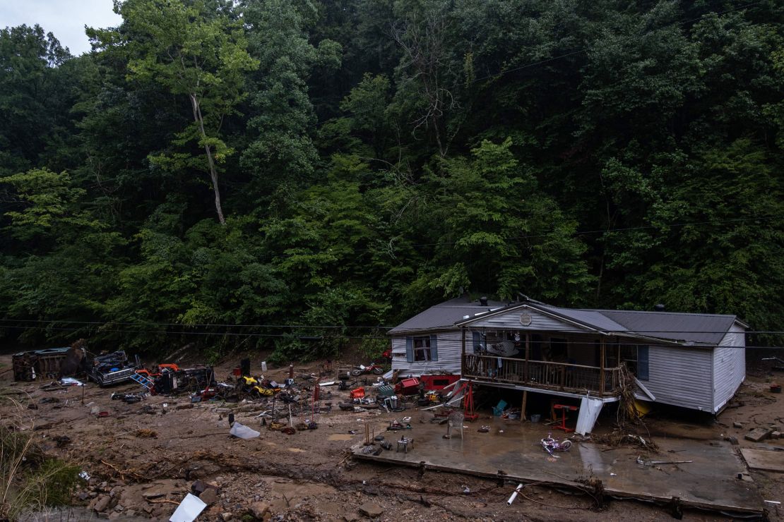 Debris surrounds a badly damaged home near Jackson, Kentucky, on July 31, 2022.