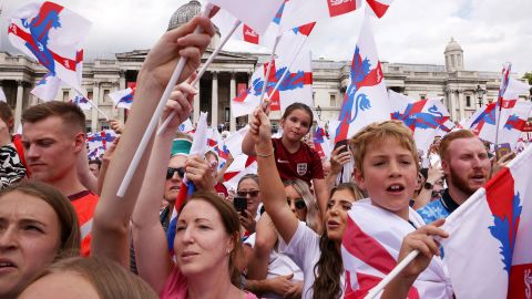 England fans wave flags during the team's celebration at Trafalgar Square.