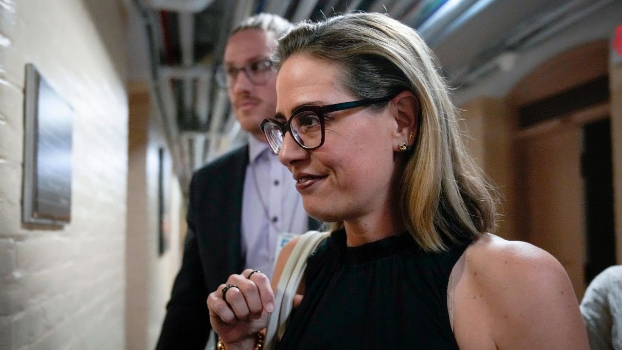 WASHINGTON, DC - JULY 28: Sen. Kyrsten Sinema (D-AZ) walks to a vote at the U.S. Capitol July 28, 2022 in Washington, DC. On Wednesday, Senate Majority Leader Chuck Schumer (D- NY) and Sen. Joe Manchin (D-WV) announced an agreement on a sweeping energy and climate bill. Named the Inflation Reduction Act of 2022, the bill includes $370 billion on energy and climate spending, roughly $300 billion in deficit reduction, three years of subsidies for Affordable Care Act premiums, some prescription drug reforms and significant tax modifications. (Photo by Drew Angerer/Getty Images)
