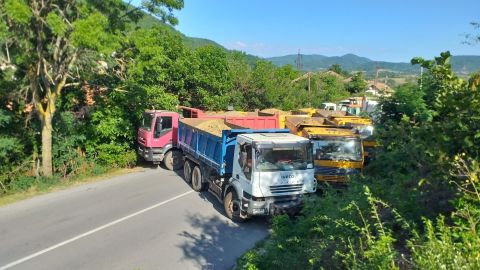 Trucks block the road near the Jarinje border crossing in Mitrovica, Kosovo on August 1.