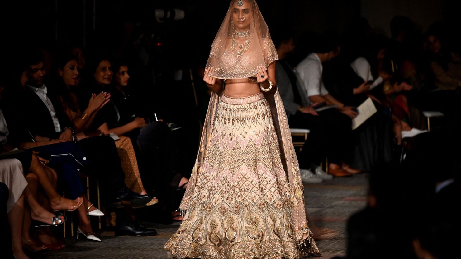 A model presents a creation by designer Tarun Tahiliani during the FDCI India Couture Week in New Delhi on July 22, 2022. - -- IMAGE RESTRICTED TO EDITORIAL USE - STRICTLY NO COMMERCIAL USE -- (Photo by Sajjad HUSSAIN / AFP) / -- IMAGE RESTRICTED TO EDITORIAL USE - STRICTLY NO COMMERCIAL USE -- (Photo by SAJJAD HUSSAIN/AFP via Getty Images)