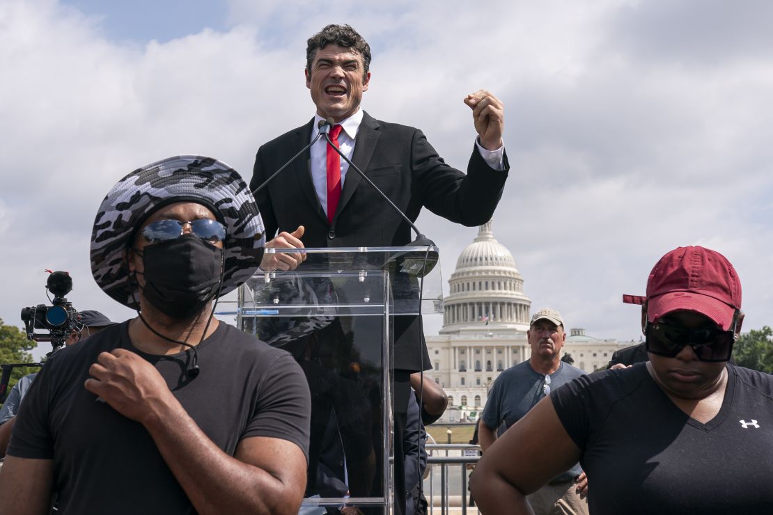 Joe Kent, center, a Republican who is challenging U.S. Rep. Jaime Herrera Beutler, R-Wash., for her seat in Washington's 3rd Congressional District, speaks during a "Justice For J6" rally near the U.S. Capitol in Washington, on Sept. 18, 2021, in support of people who took part in the Jan. 6 insurrection at the U.S. Capitol. 