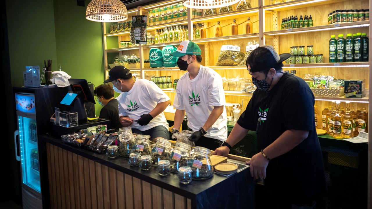 Staff prepare cannabis at a store along Bangkok's popular Khaosan Road.