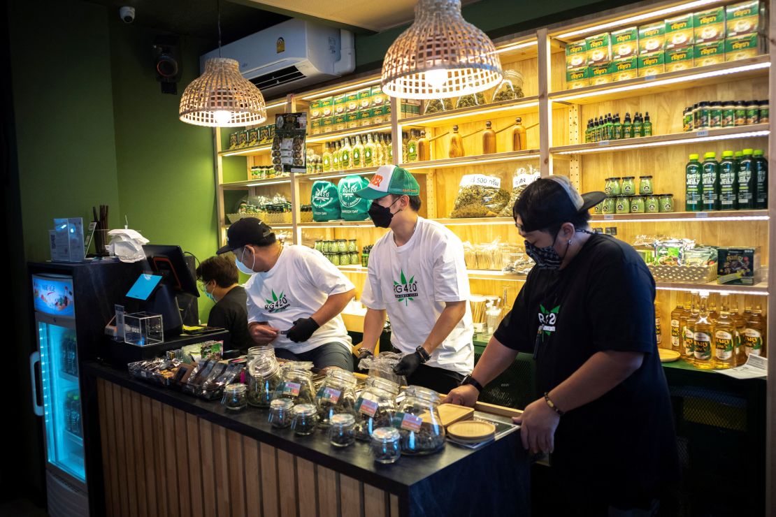 Staff prepare cannabis at a store along Bangkok's popular Khaosan Road.