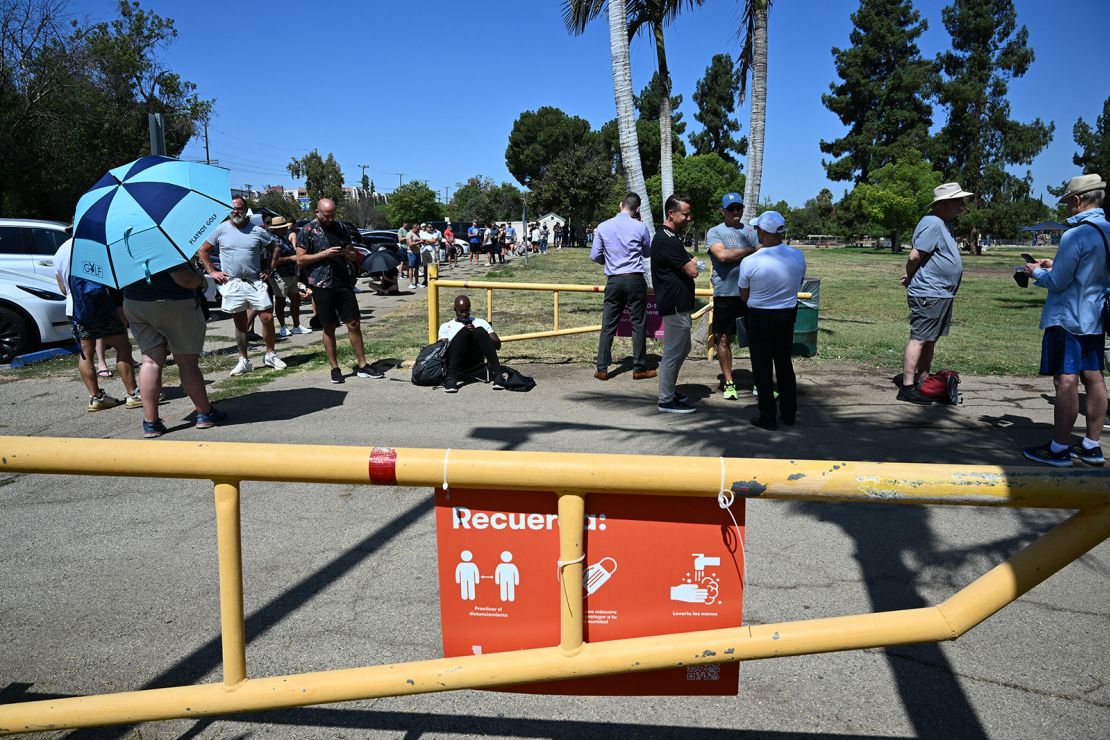 People line up to receive the monkeypox vaccine at a vaccination site at the Balboa Sports Center in the Encino neighborhood of Los Angeles, California, on July 27, 2022. 