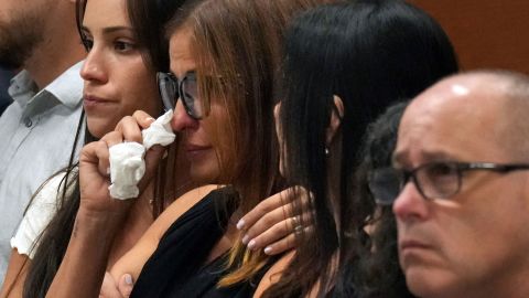 Patricia Oliver is comforted as a witness testifies to her son's fatal injuries during the penalty phase of the trial of Marjory Stoneman Douglas High School shooter Nikolas Cruz.