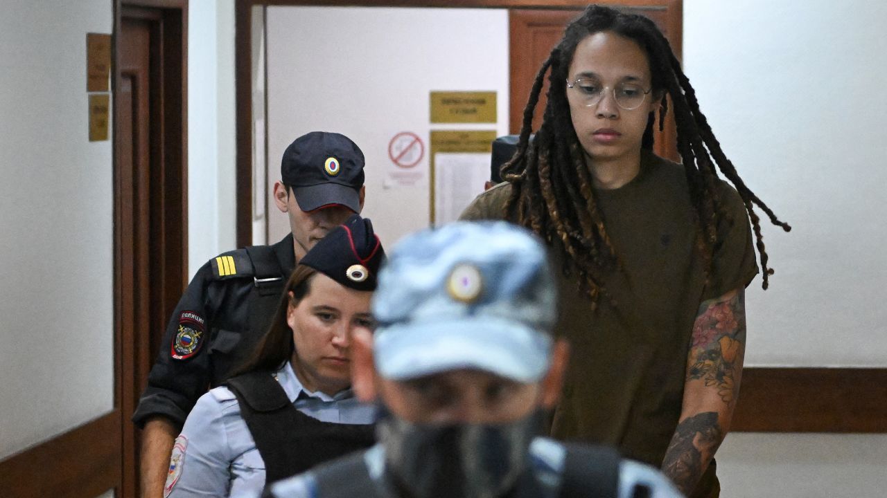US basketball player Brittney Griner (R) is escorted by police before a hearing during her trial on charges of drug smuggling, in Khimki, outside Moscow on August 2, 2022. - Griner was detained at Moscow's Sheremetyevo airport in February 2022 just days before Moscow launched its offensive in Ukraine. She was charged with drug smuggling for possessing vape cartridges with cannabis oil. Speaking at the trial on July 27, Griner said she still did not know how the cartridges ended up in her bag. (Photo by Natalia KOLESNIKOVA / AFP) (Photo by NATALIA KOLESNIKOVA/AFP via Getty Images)