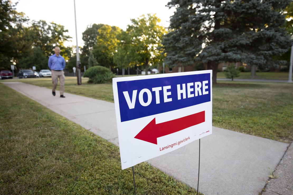 A voter arrives at a polling location to cast his ballot in the Michigan Primary Election on August 2, 2022 in Lansing, Michigan. 