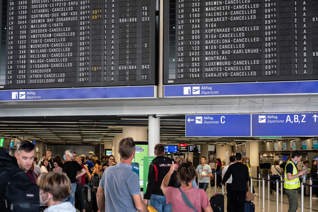 Flight attendants say the unpredictable schedules caused by cancellations and delays is tough. Pictured here: flight information boards displaying canceled flights at Germany's Frankfurt Airport in July.