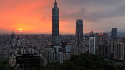This picture taken on July 22, 2018 shows a view of the Xinyi Shopping District, including the Taipei 101 building (C), at sunset in Taipei. (Photo by Daniel SHIH / AFP)        (Photo credit should read DANIEL SHIH/AFP via Getty Images)