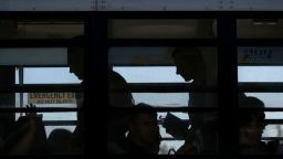 Ukrainians seeking for asylum in the United States are seen onboard a bus taking them to the border crossing at the Benito Juarez sports complex in Tijuana, Baja California state, Mexico, on April 8, 2022. (Photo by Guillermo Arias / AFP) (Photo by GUILLERMO ARIAS/AFP via Getty Images)