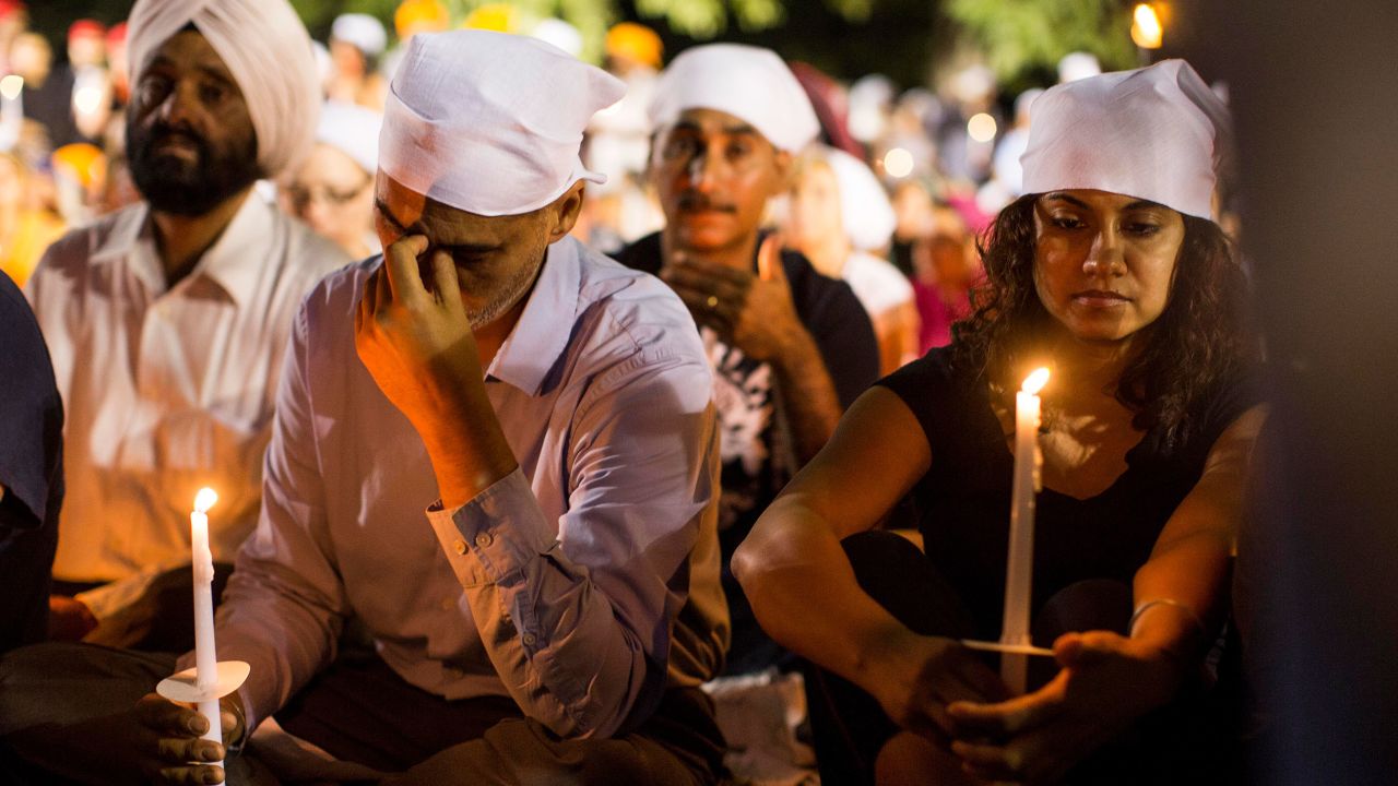 Community members attend a vigil days after the deadly mass shooting at Oak Creek's Sikh Temple of Wisconsin.