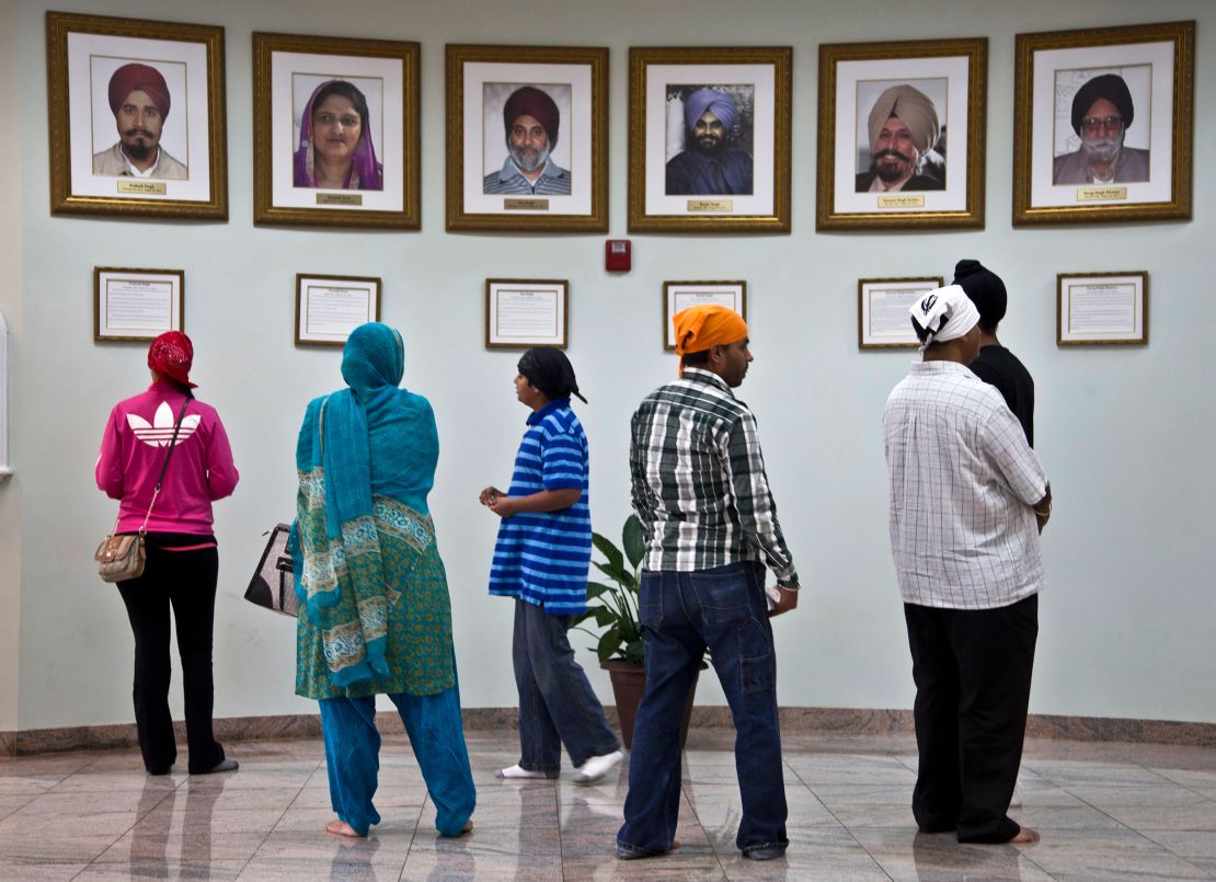 Portraits of the victims hang in the Sikh gurdwara in Oak Creek.