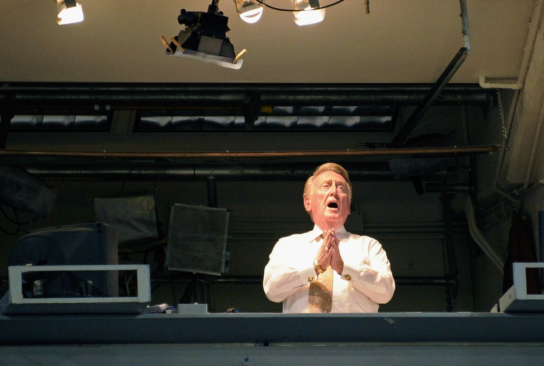 Vin Scully sings "Take Me Out to the Ball Game" during the seventh inning of a game between the Arizona Diamondbacks and the Los Angeles Dodgers on September 14, 2011.