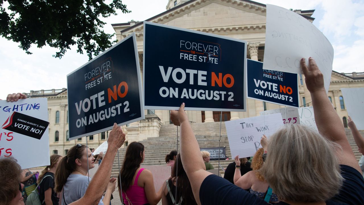 Abortion-rights supporters hold signs related to a bill that could open the door to legislation limiting or banning abortions in the state during a rally Friday at the Kansas Statehouse following the U.S. Supreme Court's decision to overturn Roe v. Wade.