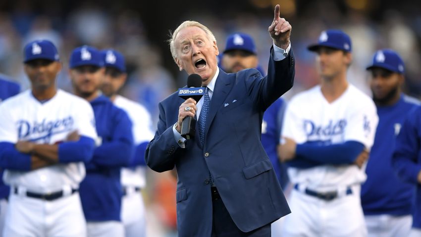 FILE - Los Angeles Dodgers broadcaster Vin Scully speaks during his induction into the team's Ring of Honor prior to a baseball game between the Dodgers and the San Francisco Giants in Los Angeles on May 3, 2017, in Los Angeles. Scully, whose dulcet tones provided the soundtrack of summer while entertaining and informing Dodgers fans in Brooklyn and Los Angeles for 67 years, died Tuesday night, Aug. 2, 2022, the team said. He was 94. (AP Photo/Mark J. Terrill, File)