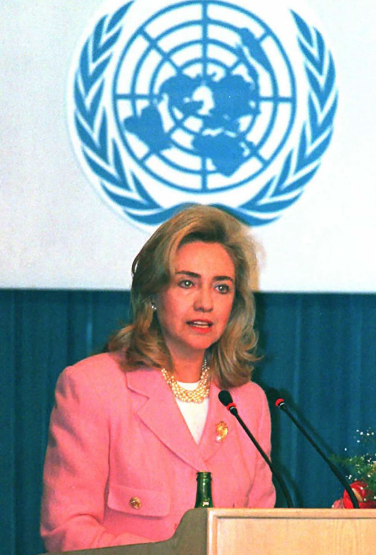 Hillary Clinton, dressed in a pink power suit, speaks in Beijing in 1995 at the UN Fourth World Conference.