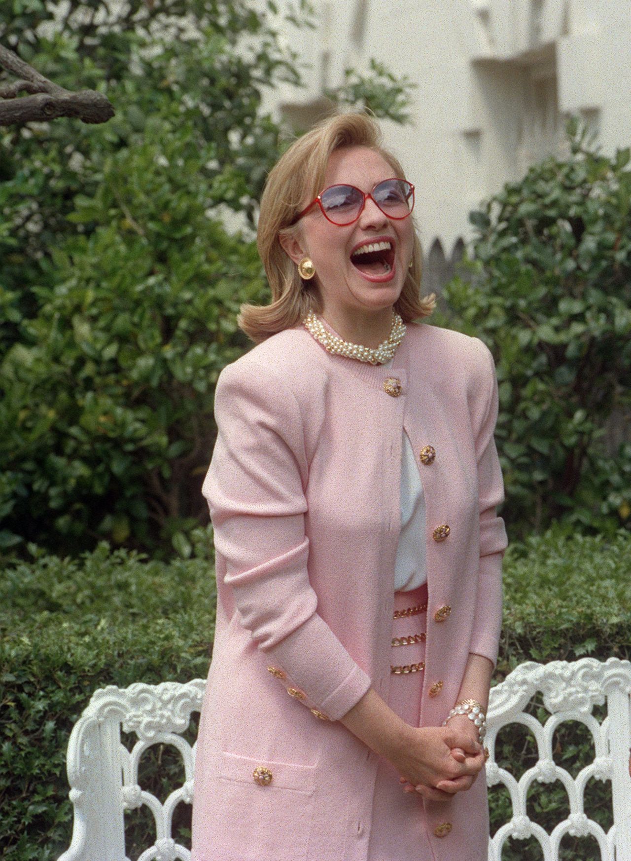 Hillary Clinton wearing a rose-hued outfit in 1995, during an exhibition opening at the White House.