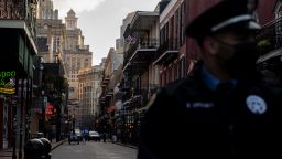 An NOPD officer stands before an empty Bourbon Street on February 16, 2021 in New Orleans, Louisiana. 