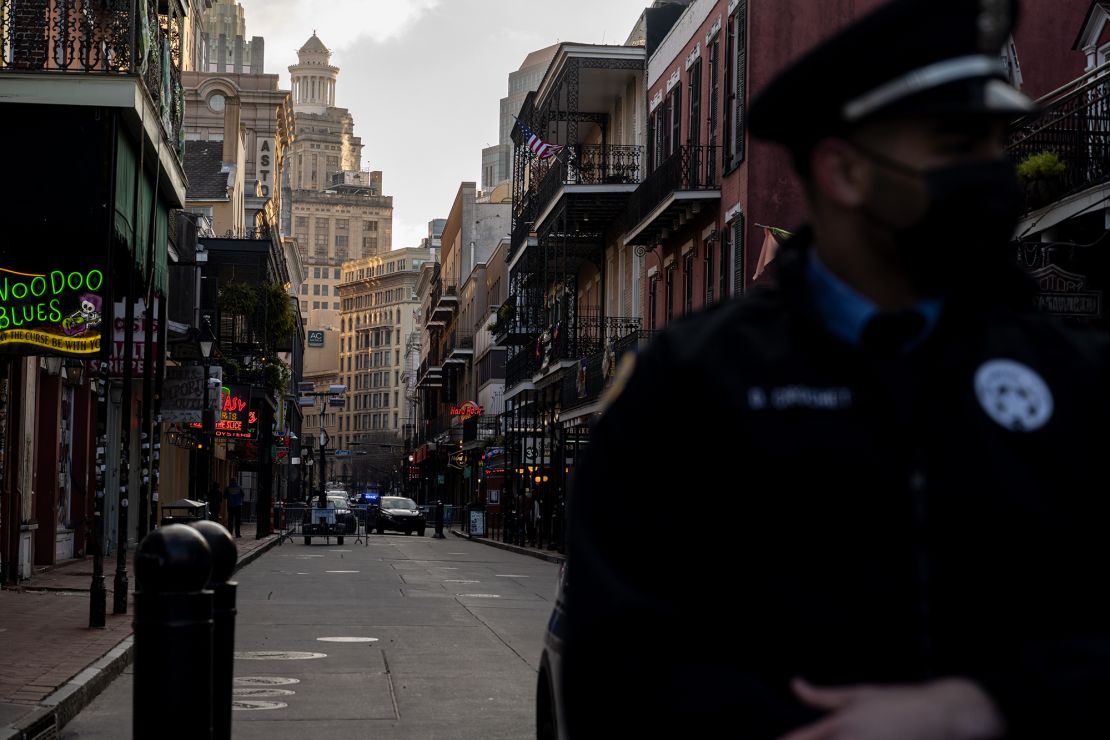 An NOPD officer stands before an empty Bourbon Street on February 16, 2021 in New Orleans, Louisiana. 
