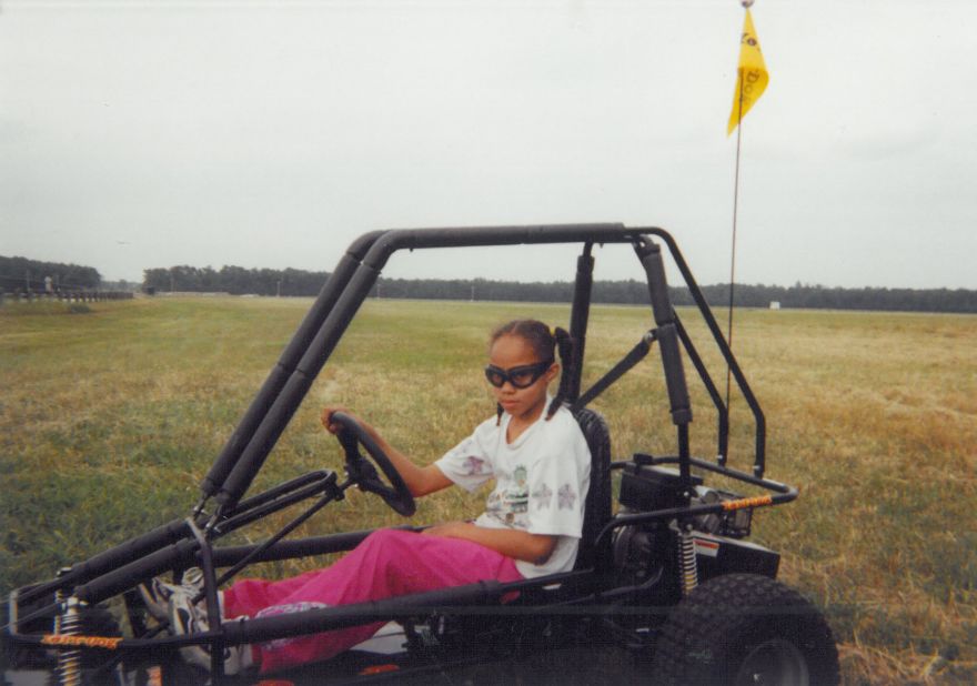 A young Griner, then in seventh grade, drives a four-wheeler.