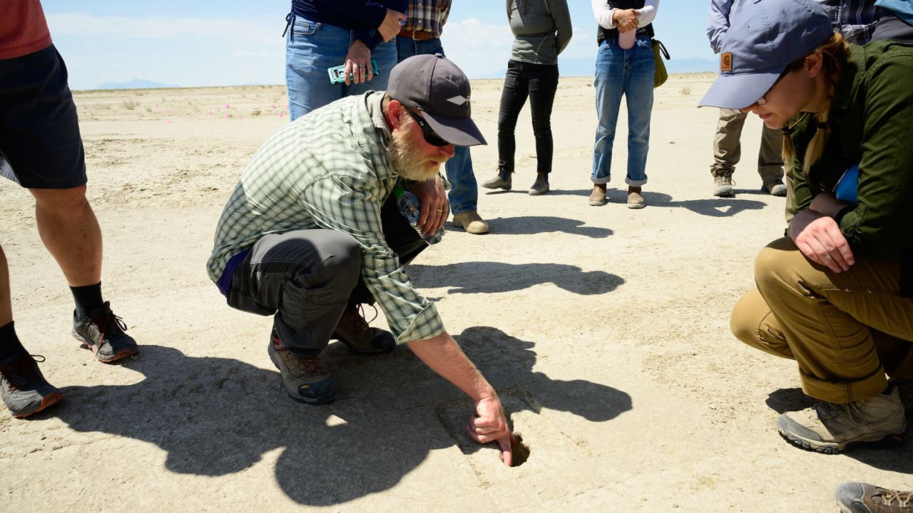 Daron Duke shows visitors footprints discovered on the Air Force's Utah Test and Training Range.