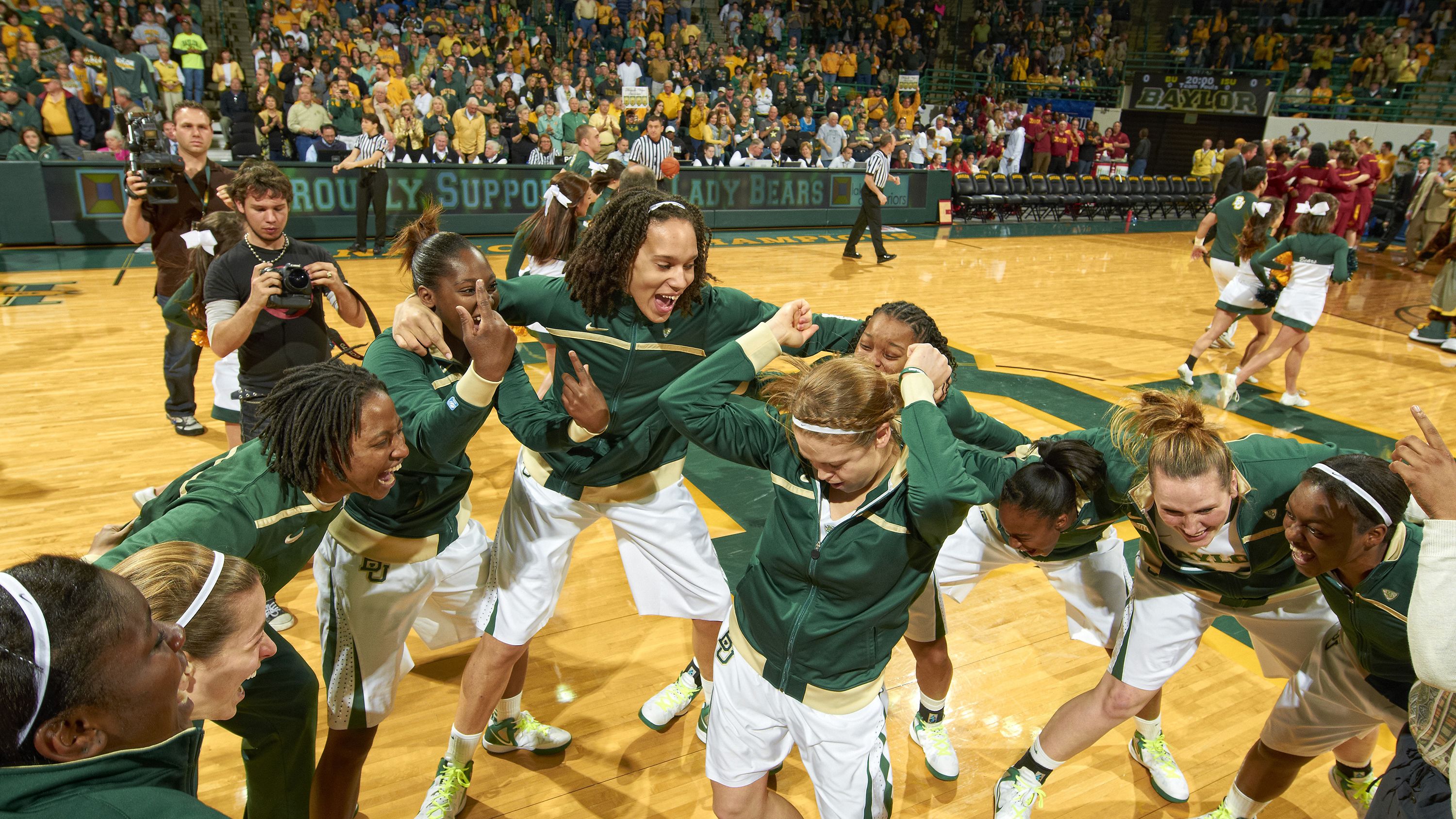 Griner huddles with teammates before a game in 2012.