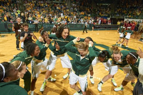 Griner huddles with teammates before a game starts in 2012.