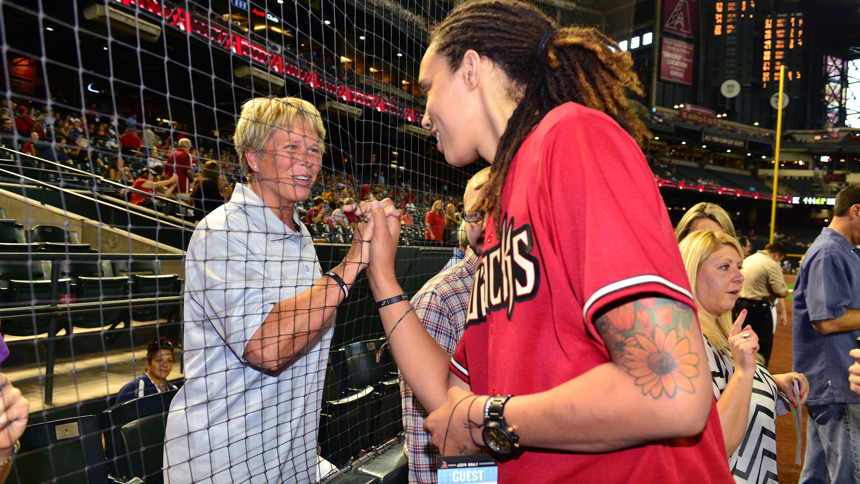 Griner talks with a fan at Chase Field in Phoenix in 2014. Griner was throwing out the ceremonial first pitch for the Arizona Diamondbacks.