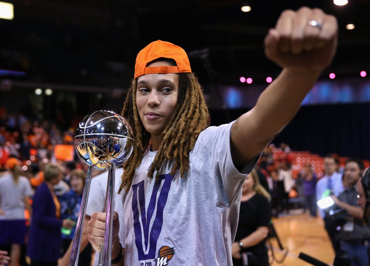 Griner holds the championship trophy after defeating the Chicago Sky in Game 3 of the WNBA Finals in September 2014 in Chicago. 