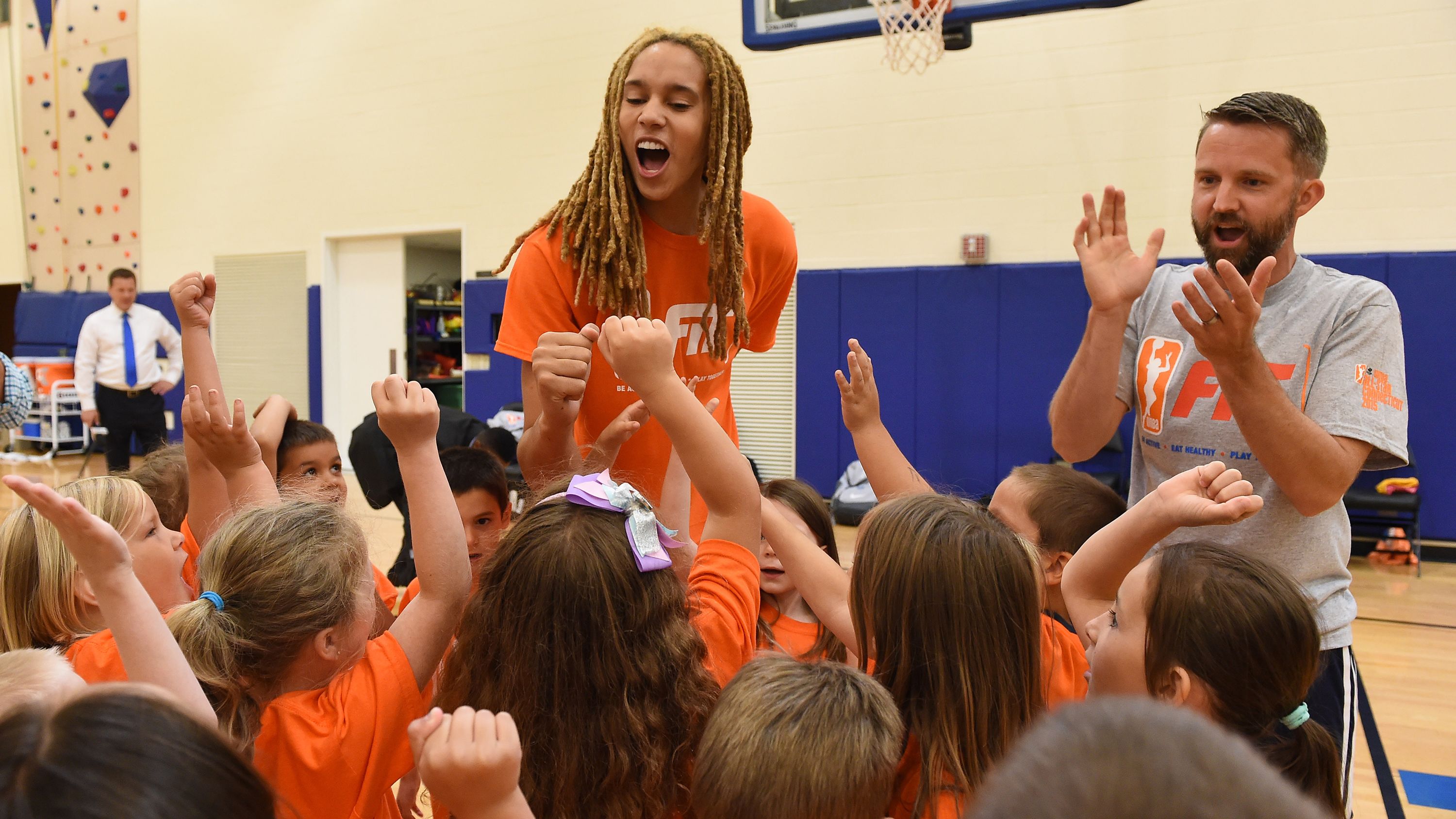 Griner huddles with a group of kids during a WNBA Fit All-Star Clinic in 2015.