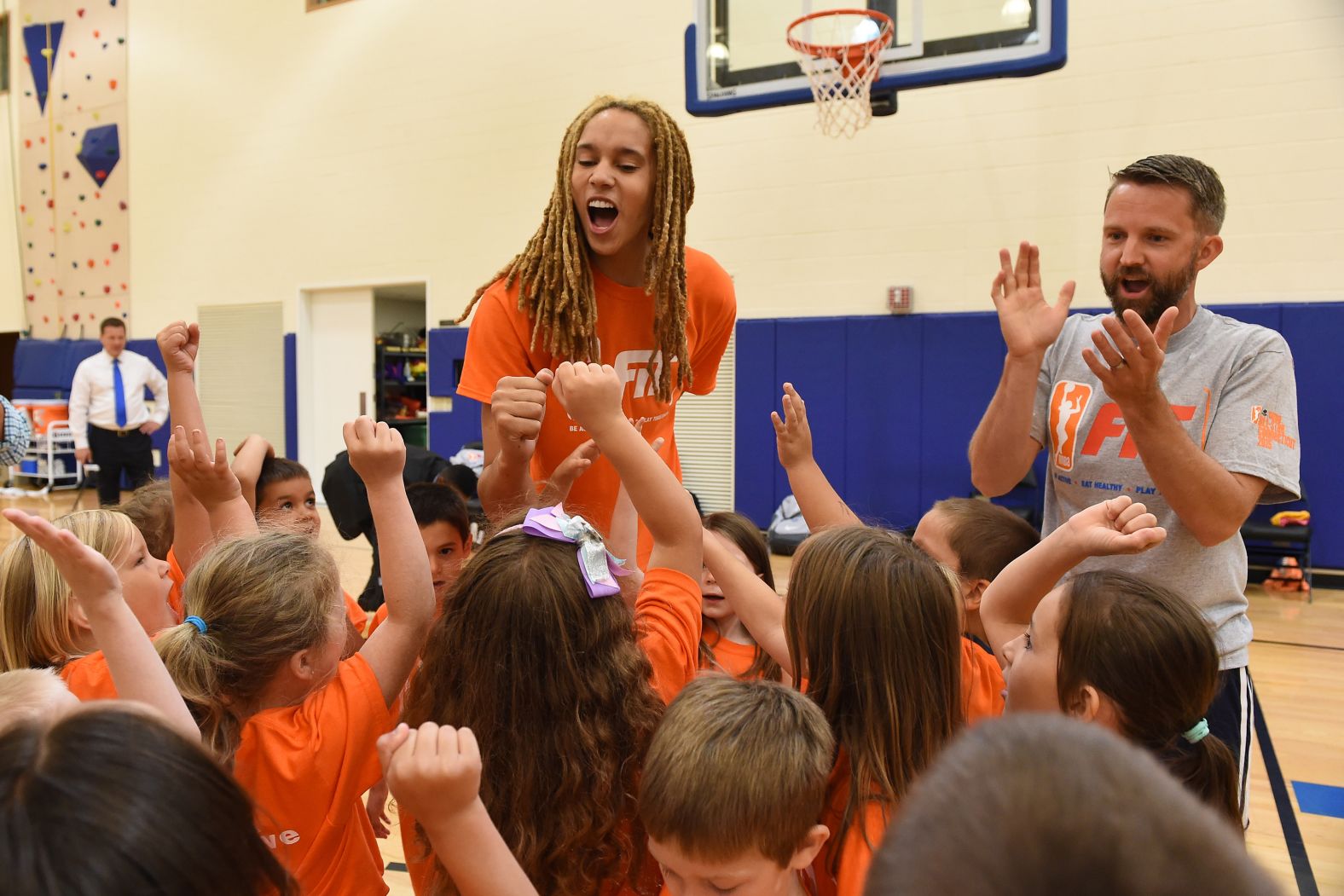 Griner huddles with a group of kids during a WNBA Fit All-Star Clinic in 2015.