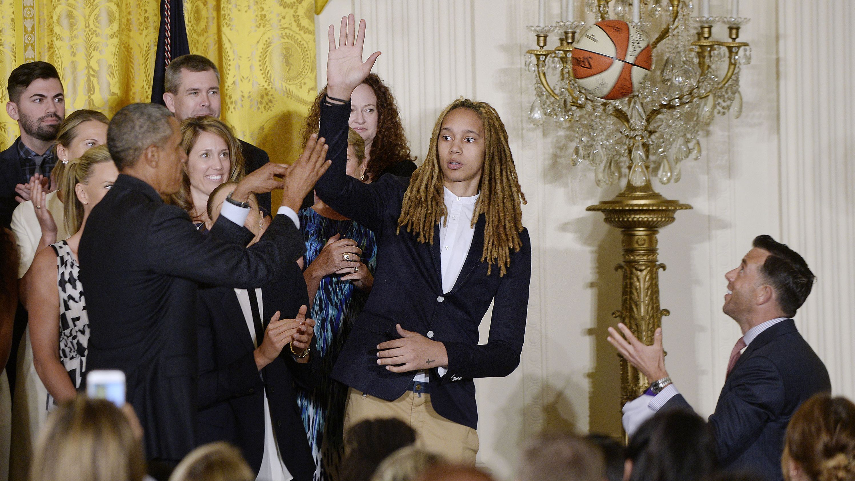 Griner high-fives Obama as the Mercury visited the White House in 2015.