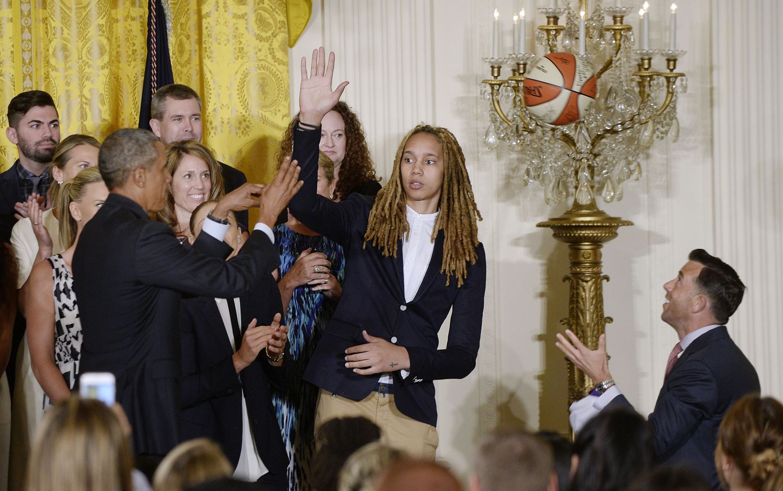 Griner high-fives Obama as the Mercury visited the White House in 2015.