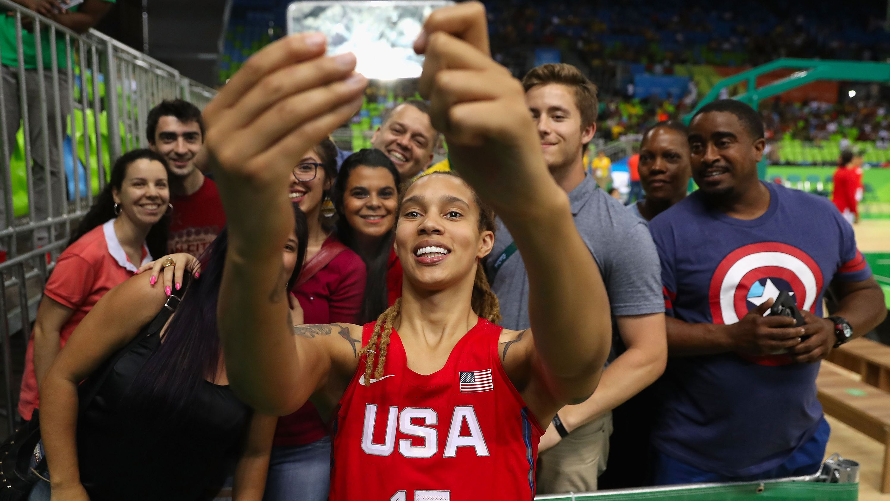 Griner poses for a selfie with fans in 2016.