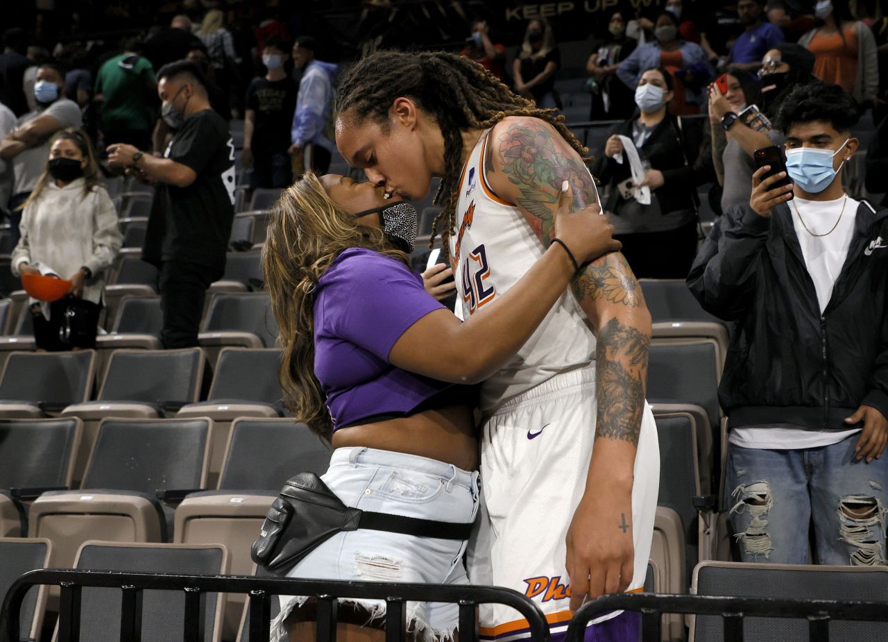 Griner kisses her wife, Cherelle, after a playoff win in 2021.