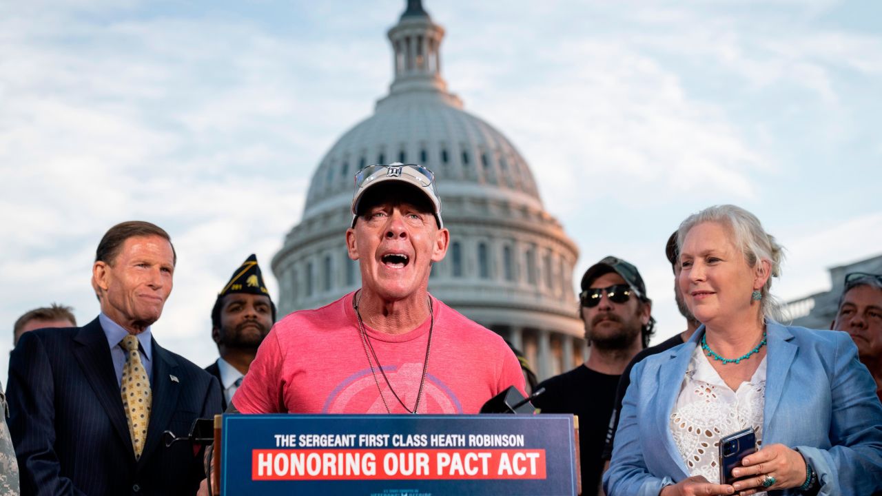 WASHINGTON, DC - AUGUST 2: Flanked by Sen. Richard Blumenthal (D-CT) and Sen. Kirsten Gillibrand (D-NY), activist John Feal speaks during a news conference with veterans and their families after the Senate passed the PACT Act at the U.S. Capitol August 2, 2022 in Washington, DC. Demonstrators from veterans-rights groups including the Wounded Warrior Project, Burn Pit 360 and the American Legion, have stood outside the Capitol Building in protest calling on the U.S. Senate to pass the PACT Act, a bill to expand health care benefits for veterans exposed to toxic burn pits. (Photo by Drew Angerer/Getty Images)