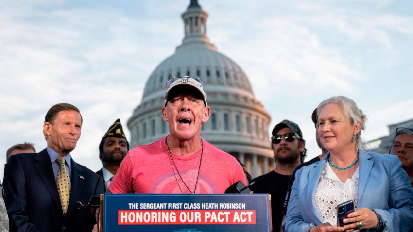 WASHINGTON, DC - AUGUST 2: Flanked by Sen. Richard Blumenthal (D-CT) and Sen. Kirsten Gillibrand (D-NY), activist John Feal speaks during a news conference with veterans and their families after the Senate passed the PACT Act at the U.S. Capitol August 2, 2022 in Washington, DC. Demonstrators from veterans-rights groups including the Wounded Warrior Project, Burn Pit 360 and the American Legion, have stood outside the Capitol Building in protest calling on the U.S. Senate to pass the PACT Act, a bill to expand health care benefits for veterans exposed to toxic burn pits. (Photo by Drew Angerer/Getty Images)
